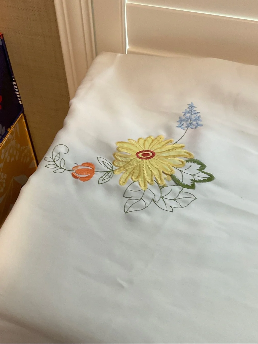 White Embroidered Floral Tablecloth with Red, Yellow & Pink Accents